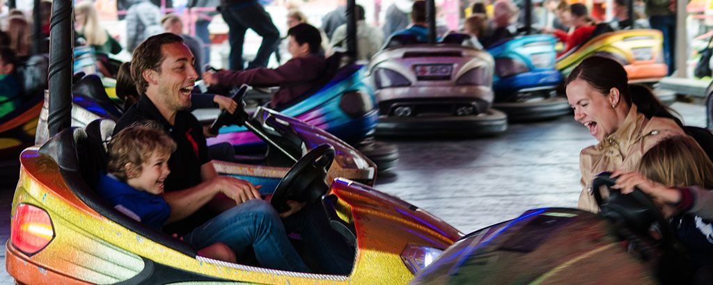 family having fun at the bumper cars